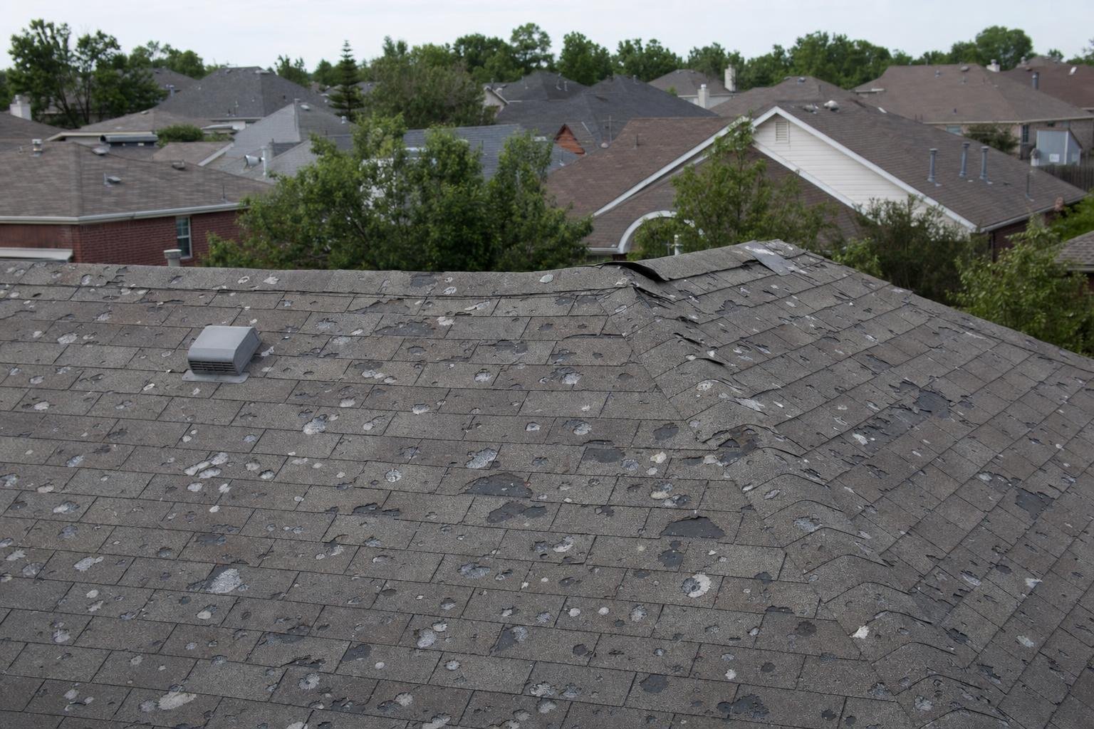 documenting hail damage on roof gutters before insurance adjuster arrives