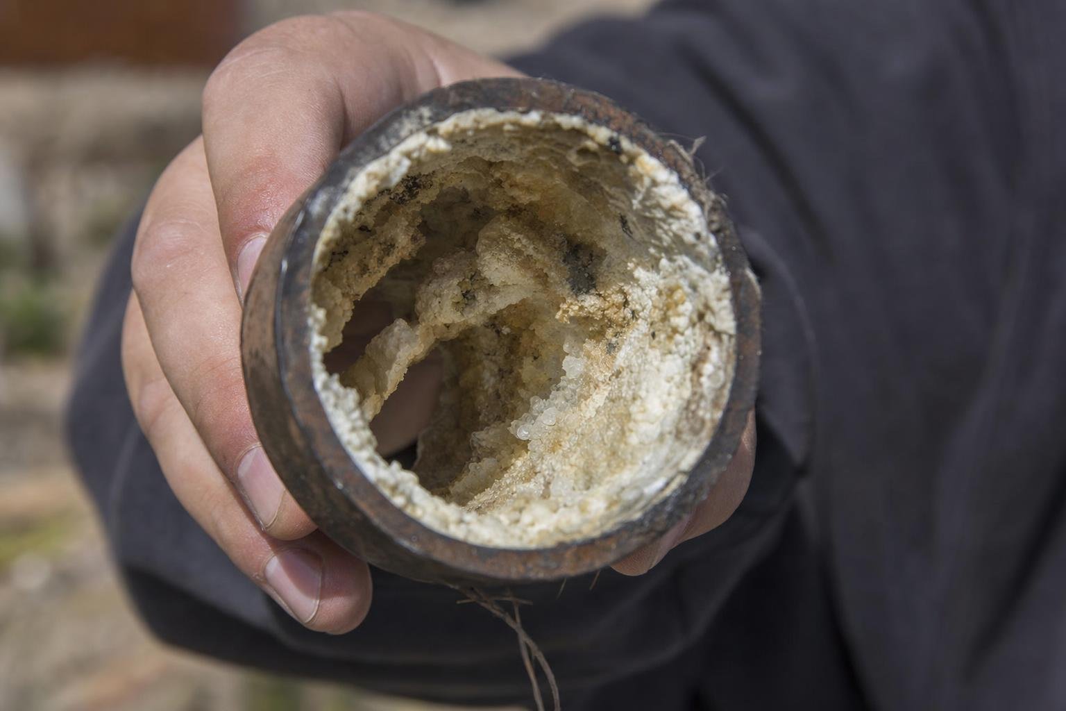 mineral buildup in pipes causing low water pressure in North Texas home